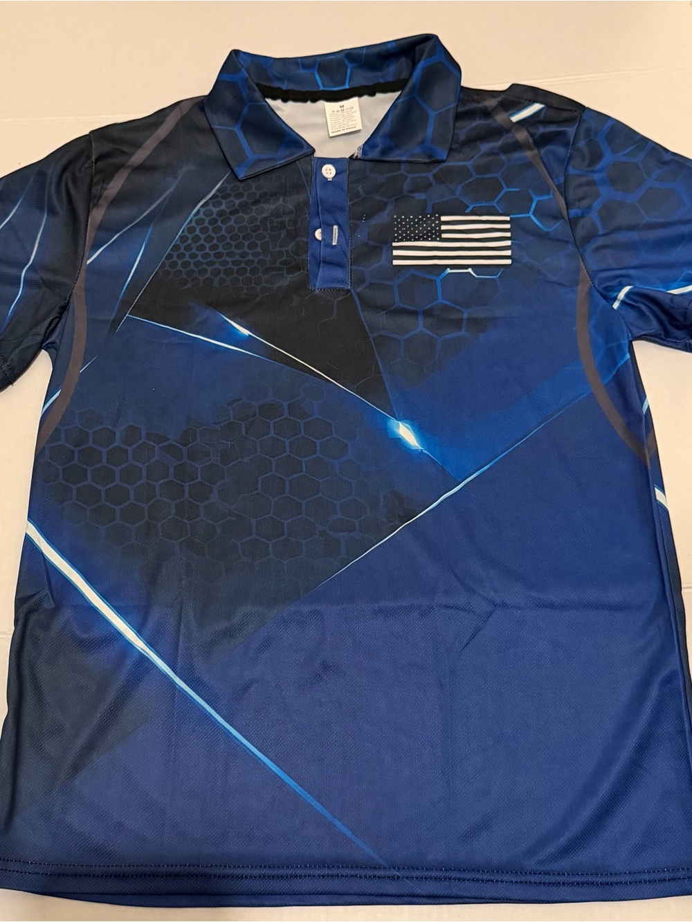 I28 Med Men's Navy and Black Geometric Polo with Flag Accent